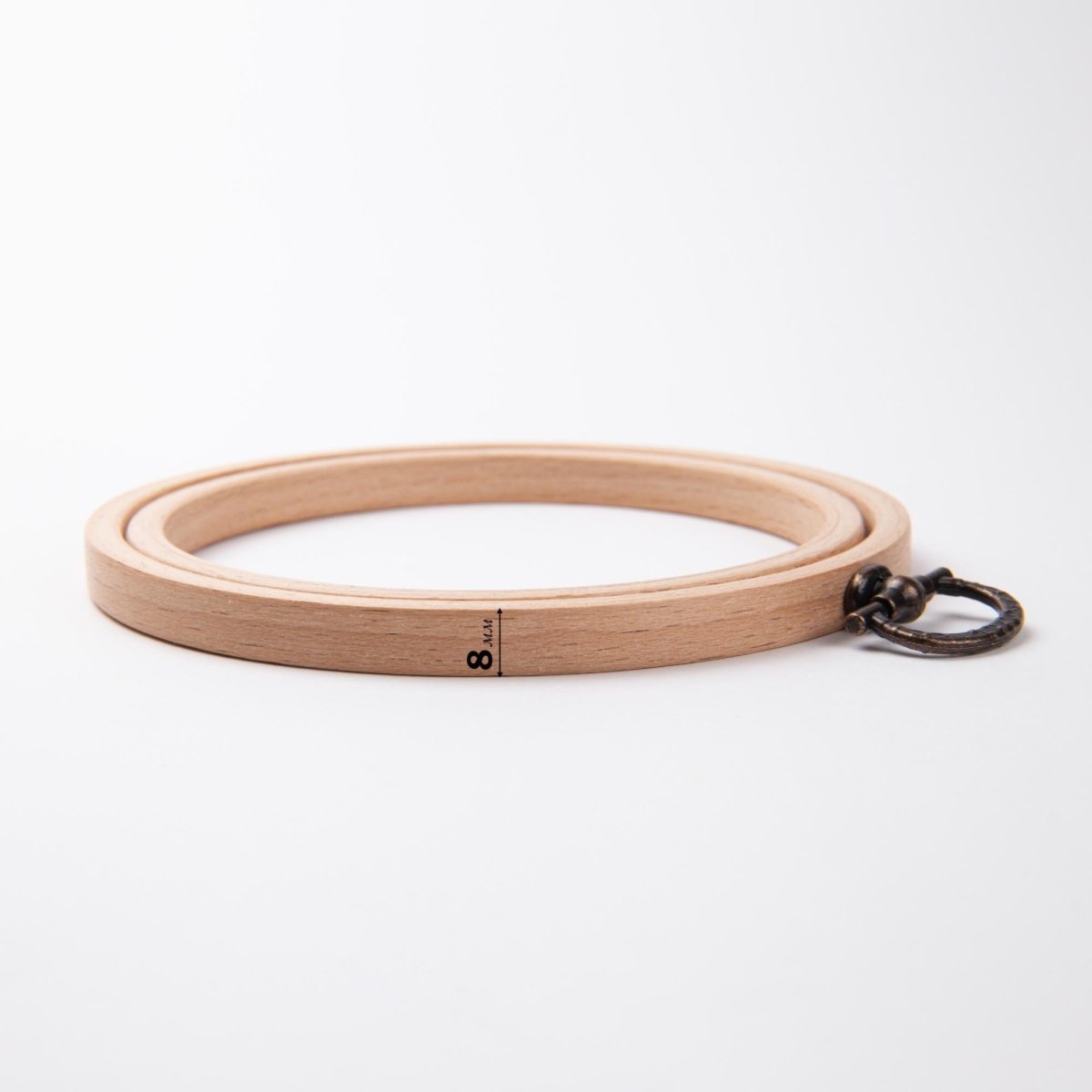 Beech wood embroidery hoop with hanging hardware.