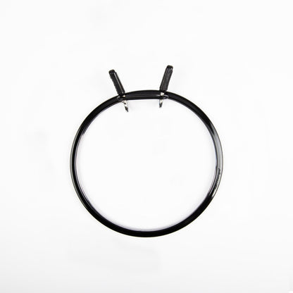 Nurge embroidery hoop with spring tension for secure fabric.