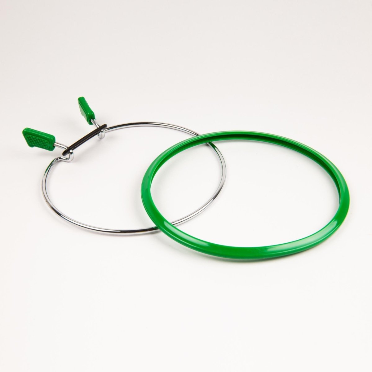 Spring tension hoop for smooth embroidery or sewing by Nurge.