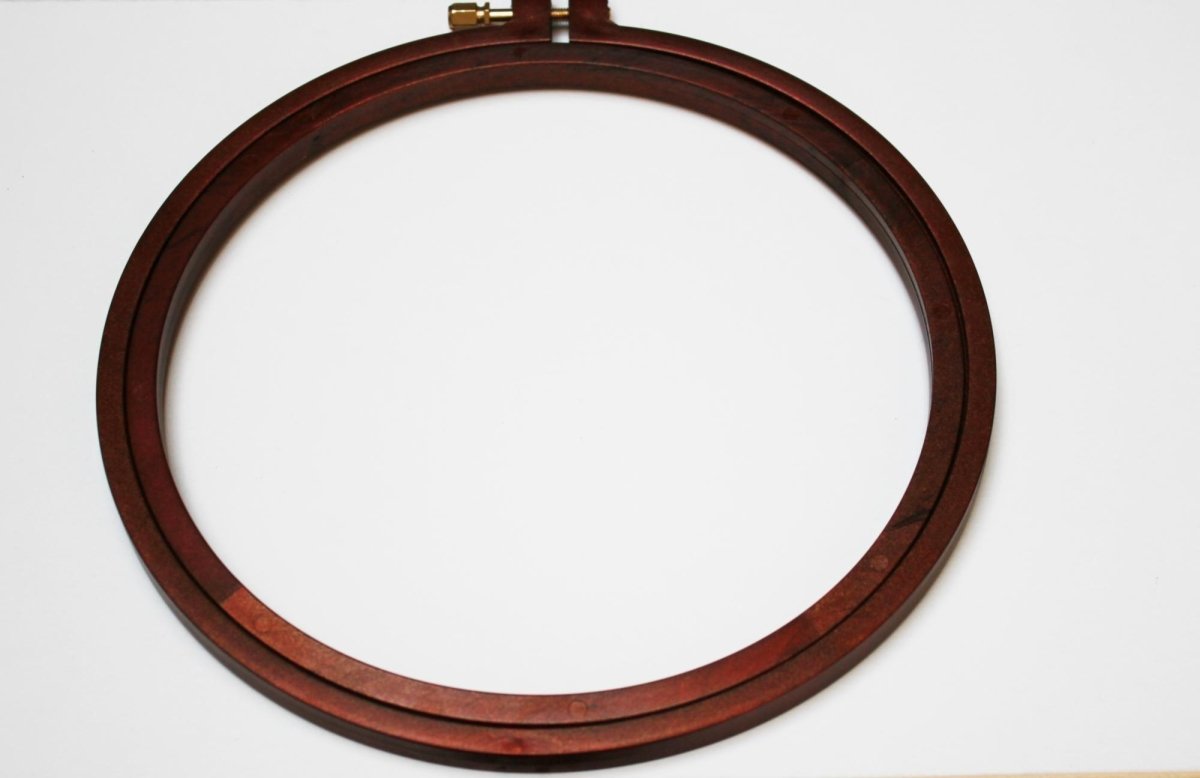 Nurge plastic embroidery hoop with screw, wood effect finish.