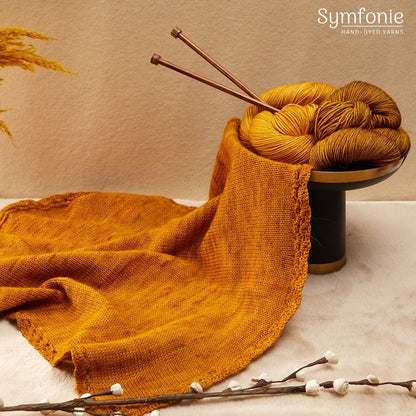 Vivid Turmeric Superwash Merino yarn.