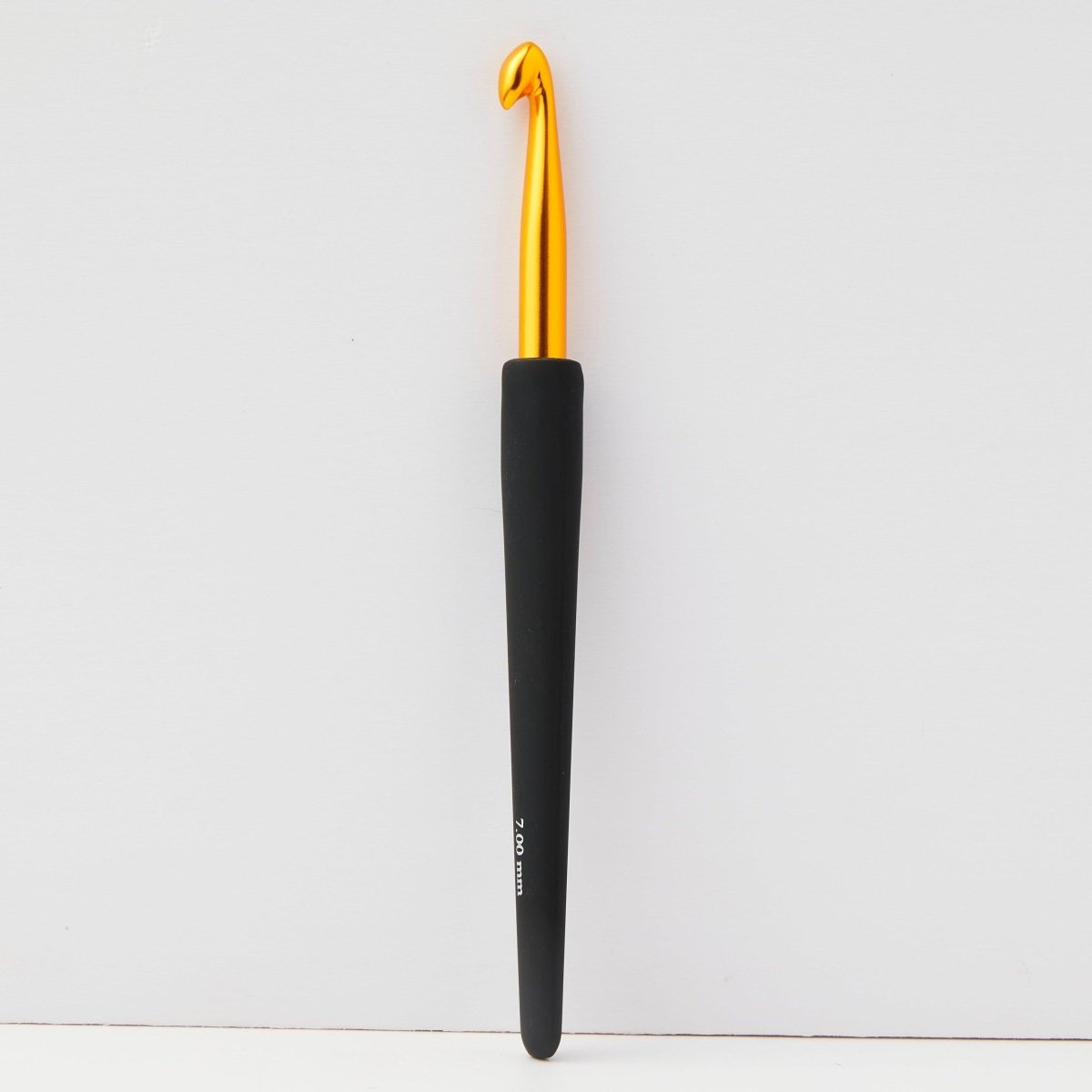 KnitPro Gold Crochet Hook featuring a plush black grip.