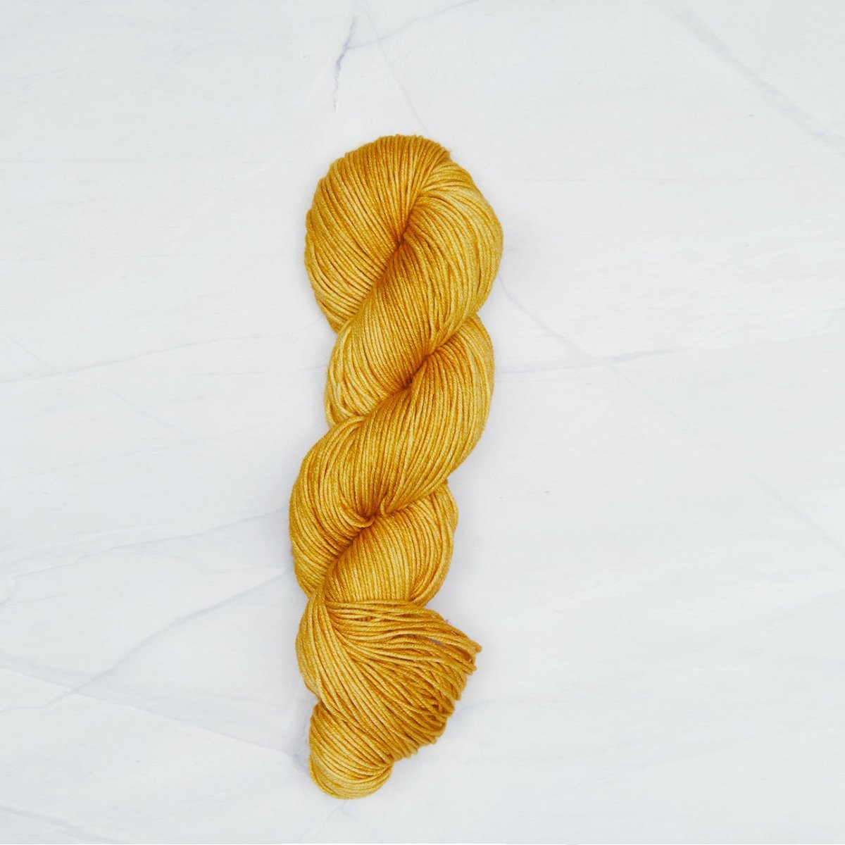 Turmeric Symfonie yarn, hand-dyed Superwash Merino.