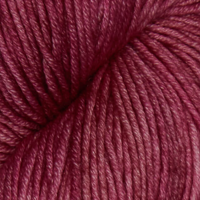 Semisolid Dusty Rose Superwash Merino yarn.