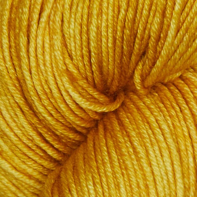 Semisolid Turmeric Superwash Merino yarn.